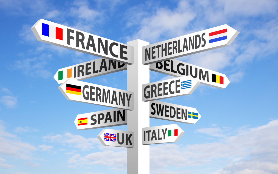 Road sign pole with several European countries shown. They include: France, Netherlands, Belgium, Ireland, Germany, Greece, Spain, Sweden, UK, Italy.
