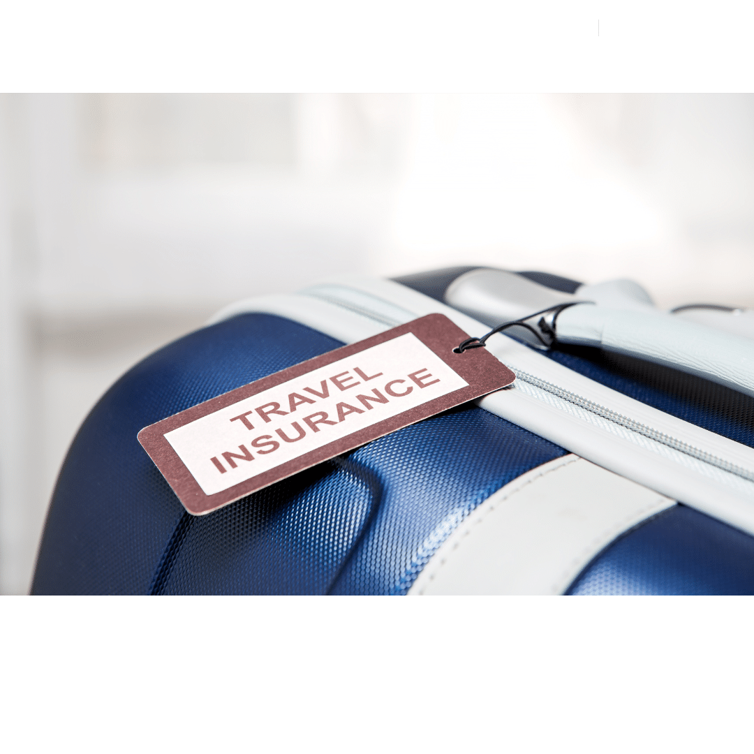 Suitcase with a tag that says "travel insurance"