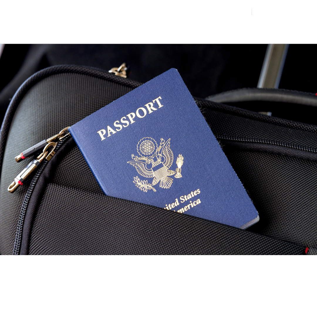 Passport sticking out of a the pocket of a black bag