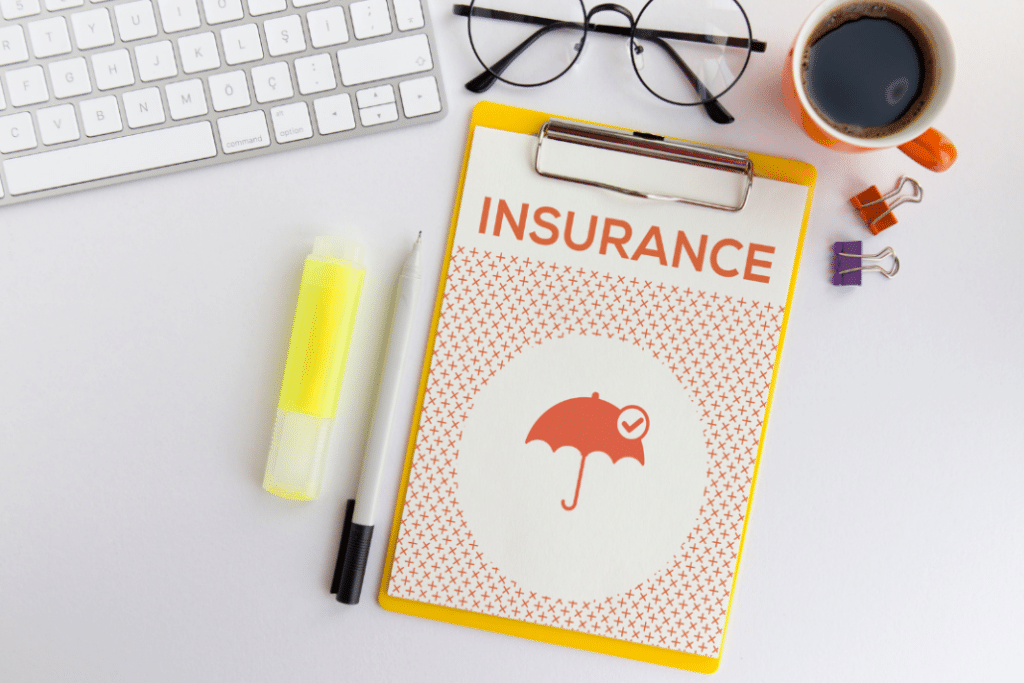 Insurance Documents sit on top of a desk with general office supplies.